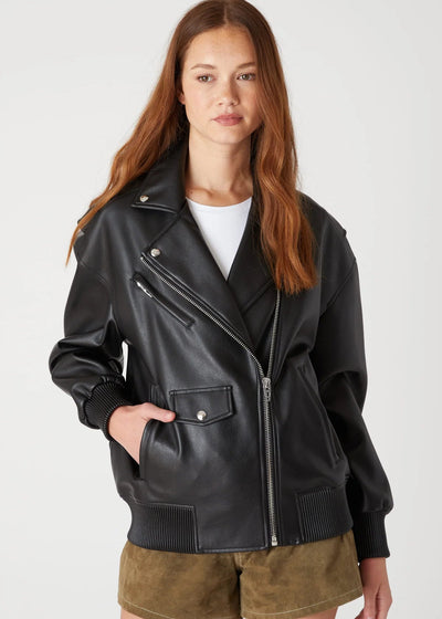 Woman wearing a black leather jacket on a white background
